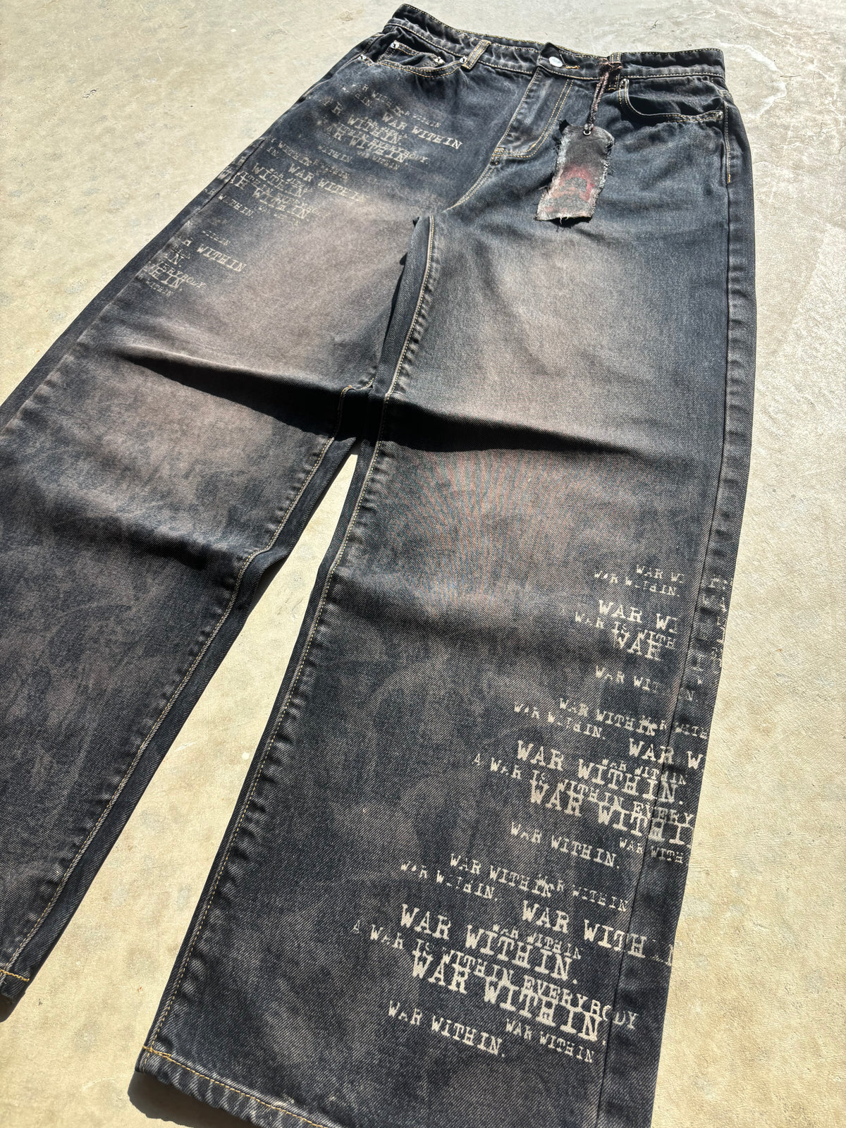 1 of 3 “TRENCH" Edition Baggy Battle Scarred denim